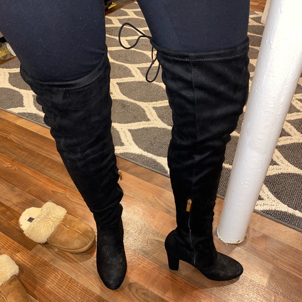 Over the knee heeled boots.